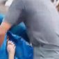 Jenazah saat diangkat dari pantai Montong oleh warga (Ist/SAR)
